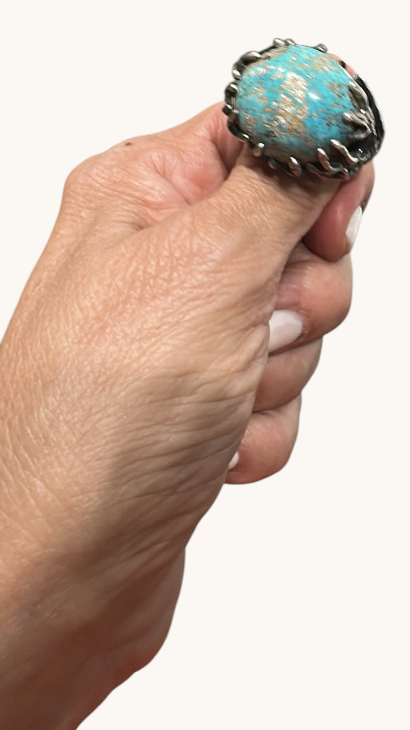 Cristal Milano oval turquoise statement ring with intricate silver-tone band and natural matrix patterns.